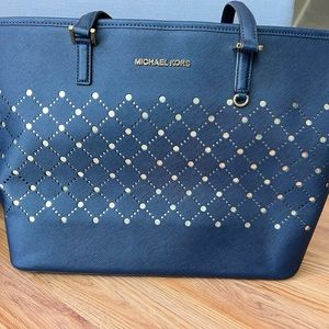 Michael Kors Carry all Tote in Navy Saffiano Leather with gold hardware/accents.